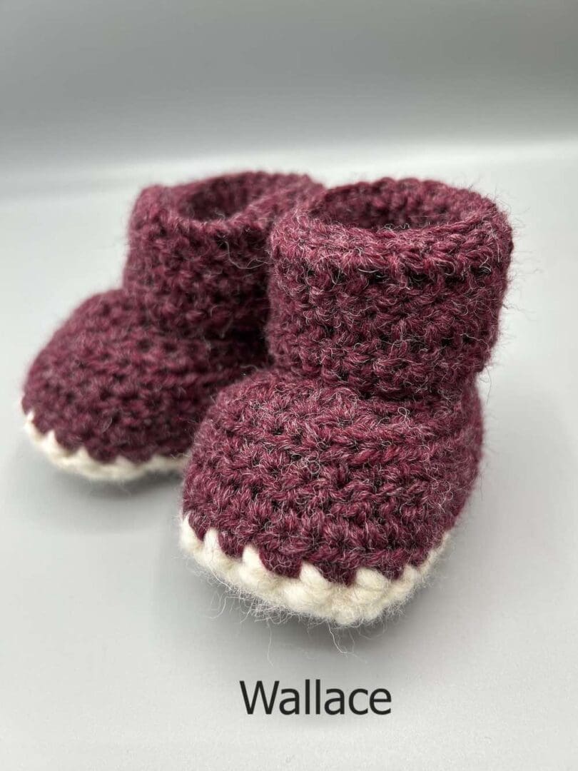 Pair of 100% Scottish Wool Baby soft shoes booties. Presented with a tartan ribbon and box. Handmade in Scotland by Midge Porter Design as part of the 'Peedie Naturals' Clan colours range - Wallace