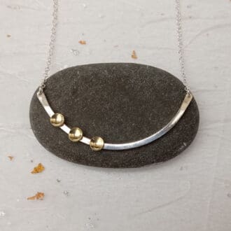 curved recycled sterling silver wire and brass cups necklace