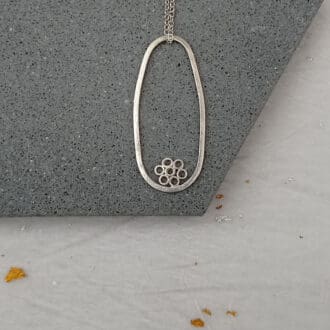 recycled sterling silver wire oval pendant with bubble flower