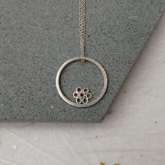 recycled sterling silver circle wire necklace with flower